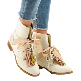 Bottines plates beiges nouées à franges A-226