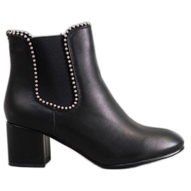 Janessa Bottines Chelsea élégantes sur un bar noir