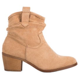 Super Mode Bottes de cowboy confortables sur un poteau brun