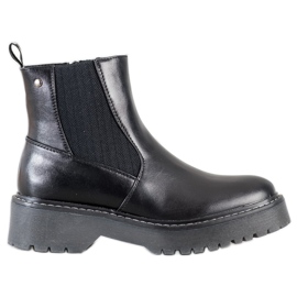 J. Star Bottes sur la plate-forme noir