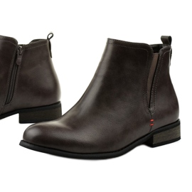 Bottes isolées grises avec une fermeture éclair Simplegleam