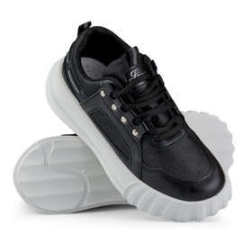 Chaussures de sport pour femme noires à semelle blanche 1