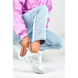 Baskets blanches pour femme avec bordure argentée 4