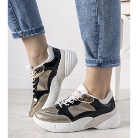 Baskets dorées à semelle haute Rude noir 1