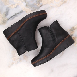 Bottines compensées noires confortables et isolées pour femme Rieker X9165-00 le noir 6
