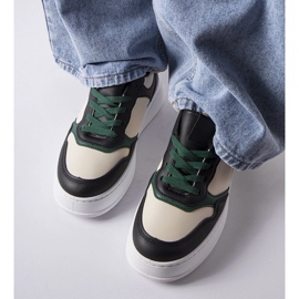 Baskets noires et vertes sur la plateforme Baron le noir 1