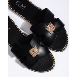 Claquettes plates noires pour femme 1