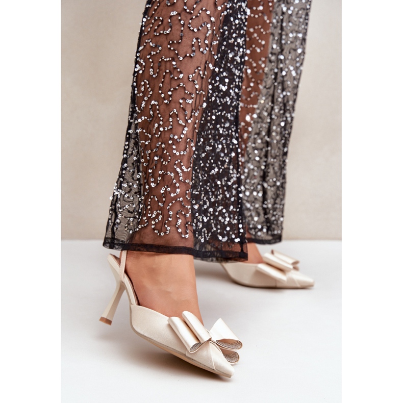 Step in style Talons hauts dorés pour femmes élégantes avec un nœud 1