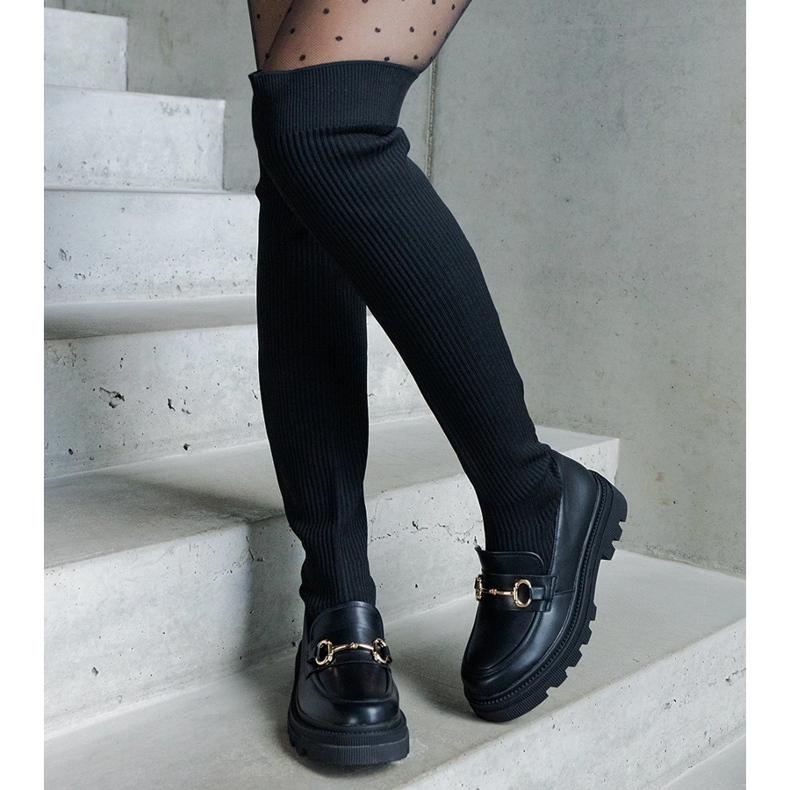 Boots noires à tige souple et talon plat 1