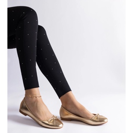 Ballerines dorées ornées d'un nœud d'or 2