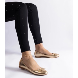 Ballerines dorées ornées d'un nœud 1