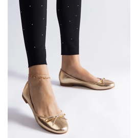 Ballerines dorées ornées d'un nœud d'or 4
