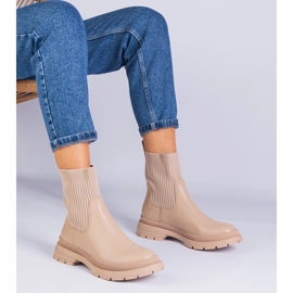 Bottes brunes avec un matériau supérieur beige 1 Bottes brunes avec un matériau supérieur beige 1
