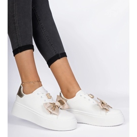 Baskets blanches et or pour femmes avec un arc 2