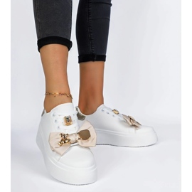 Baskets blanches et or pour femmes avec un arc 3