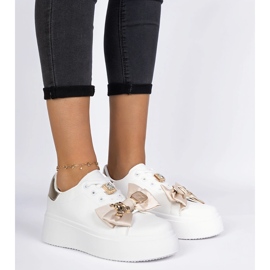 Baskets blanches et or pour femmes avec un arc 4