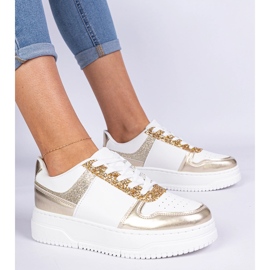 Baskets pour femmes dorées sur une semelle épaisse décorée de paillettes 2