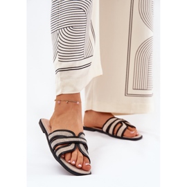 Les tongs plats beige plats classiques des tongs-noir 2 Les tongs plats beige plats classiques des tongs-noir 2