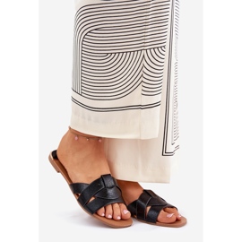 Les tongs plats des femmes avec des rayures noires le noir 1 Les tongs plats des femmes avec des rayures noires le noir 1