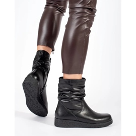 Bottines pour femmes en cuir noir sur une semelle basse avec une tige à volants par Sergio Leone le noir 5