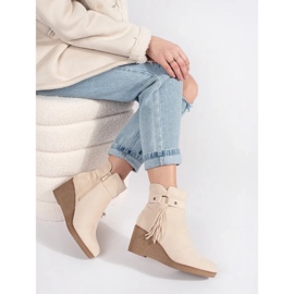 Bottines compensées femme en daim beige clair à franges 3