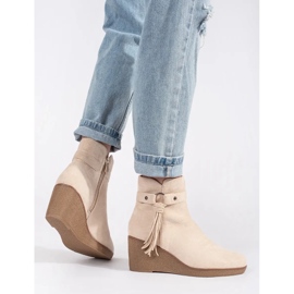 Bottines compensées femme en daim beige clair à franges 4