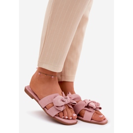 Les tongs plats des femmes avec un arc rose 1