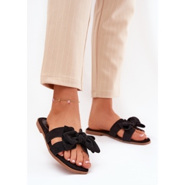 Les tongs plats des femmes avec un arc noir le noir 2