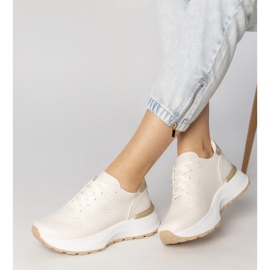 Sneakers sportifs beige avec une insertion d'or 2