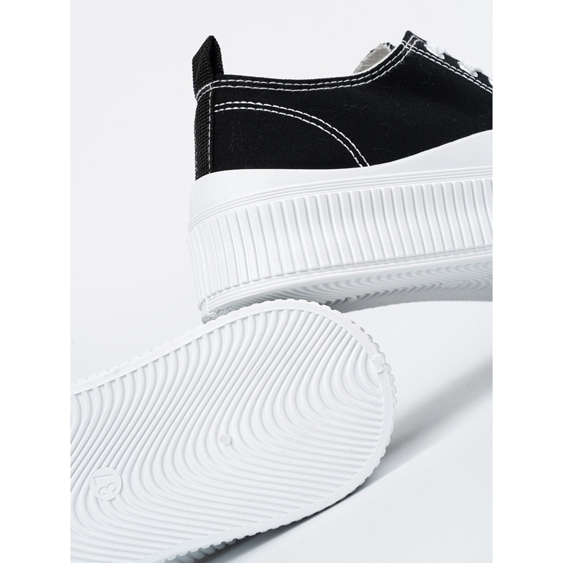 Baskets noires et blanches à semelle épaisse le noir 1