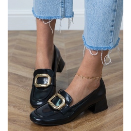 Chaussures à thèmes basses noires avec une décoration dorée 2