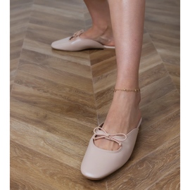 Flip beige -flops construit sur une semelle plate 3