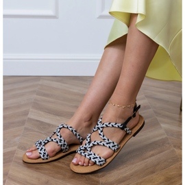 Sandales noires avec une tresse sur une semelle plate le noir 3