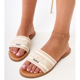 Les tongs beiges avec une sangle brodée 3