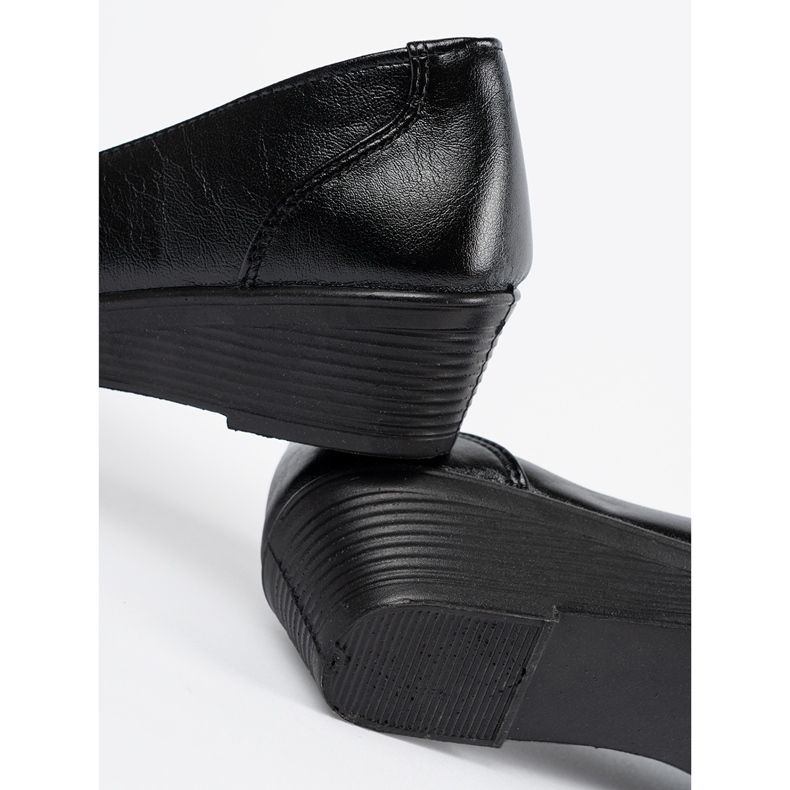 Chaussures coulissantes noires avec un arc 1