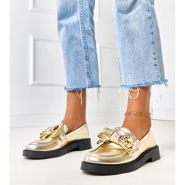 Mocassins dorés avec un arc et un ours en peluche teriwa 1