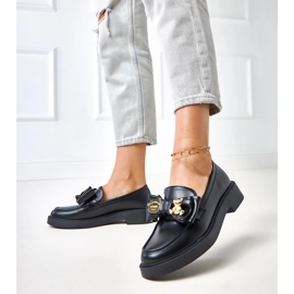 Muisseaux noirs avec un arc et un ours en peluche teriwa 2