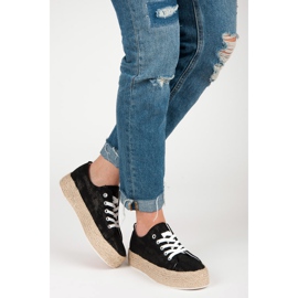 Espadrilles noires sur la reliure le noir 1