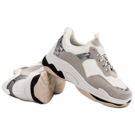 Baskets blanches à motif noir brun 1