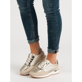 Chaussures de sport dorées d'or 1