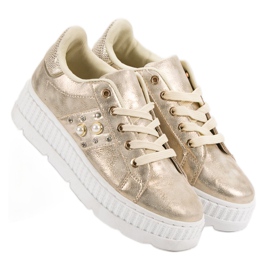 Chaussures d'or sur la plate-forme 1