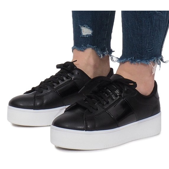 Baskets noires sur la plateforme Livet De Lux le noir 1