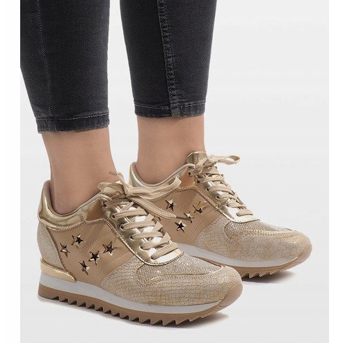 Baskets dorées sur le coin G-127 d'or 1