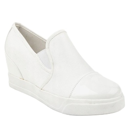 Baskets blanches sur le talon compensé R27-5 1