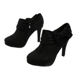 Bottes noires sur un talon haut avec un élastique Fharvix 2