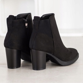 Super Mode Bottines noires sur un poteau 1