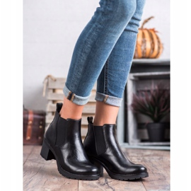 W. Potocki Bottines Chelsea noires sur un bar le noir 4
