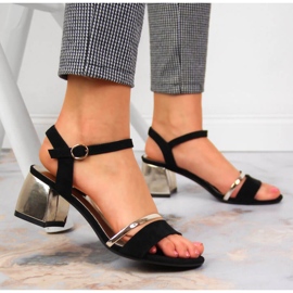 Sandales noires et dorées sur le poteau de Sergio Leone le noir d'or 2