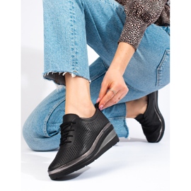 Chaussures compensées en cuir noir par T.Sokolski 1